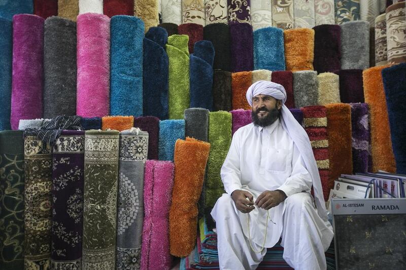 Noorullah Khan, one of the oldest carpet sellers in Abu Dhabi, counts the late Sheikh Zayed among his customers over the last three decades. Very few know that the carpet market on Mina Zayed is one of the oldest markets in the capital. Mona Al Marzooqi / The National