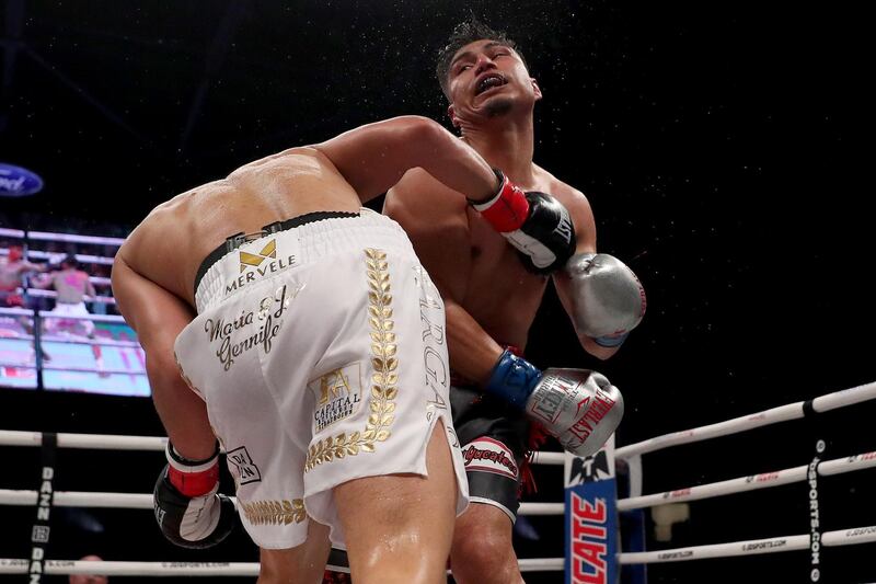 Mikey Garcia punches Jessie Vargas. AFP