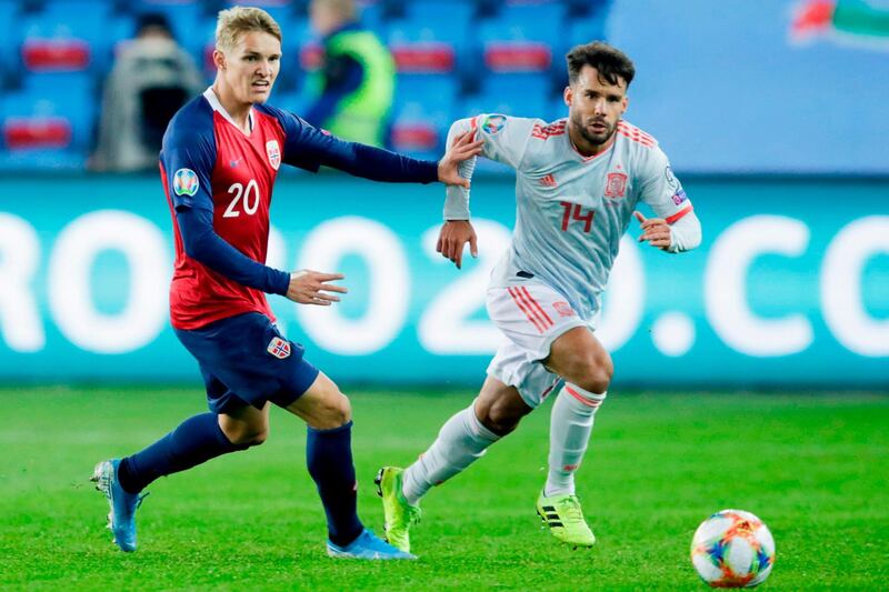 Norway's Norway's midfielder Martin Odegaard (L) and Spain's defender Juan Bernat vie for the ball during the Euro 2020 qualifying football match Norway v Spain in Oslo, Norway.  AFP