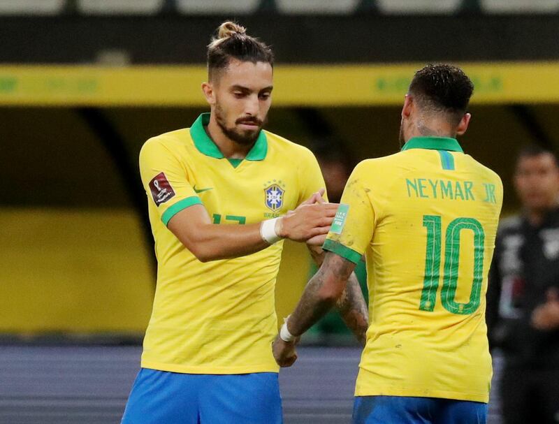 Brazil's Neymar with Alex Telles after the match. Reuters