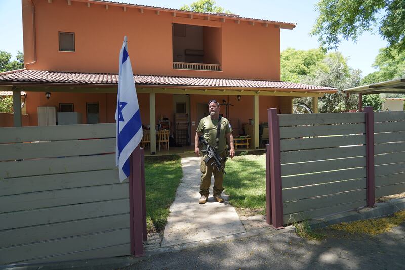 Lior Shelef stands in front of the house he built in Kibbutz Snir