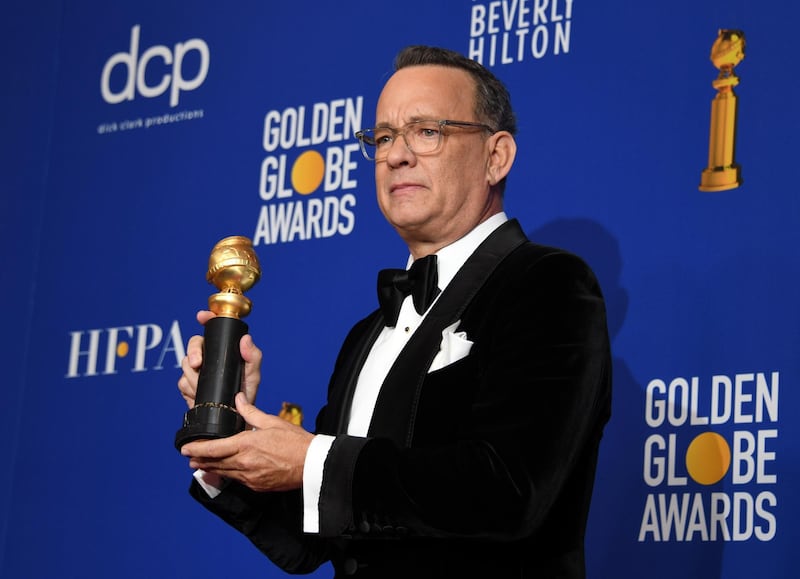 Tom Hanks poses with his Cecil B DeMille Award during the 77th annual Golden Globe Awards on January 5, 2020, at The Beverly Hilton hotel in Beverly Hills, California. Reuters