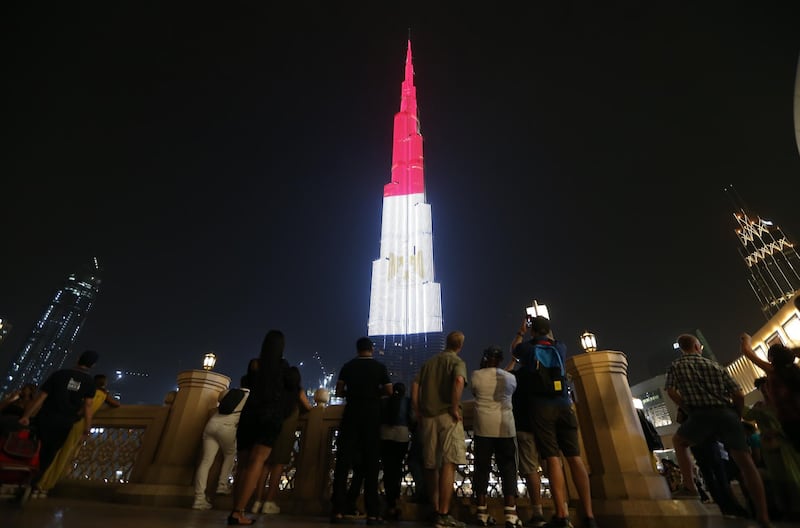 epa07736075 The World's tallest skyscraper Burj Khalifa is illuminated in the colors of the Egyptian flag to mark the Egyptian national day in Dubai, United Arab Emirates, 23 July 2019. Egypt celebrates annually on 23 July the revolution of 1952 that removed the Royal rule and led to the creation of the first Egyptian republic.  EPA/ALI HAIDER