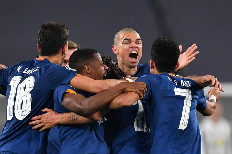 Sergio Oliveira of Porto celebrates with team-mates after scoring again during extra time. Getty