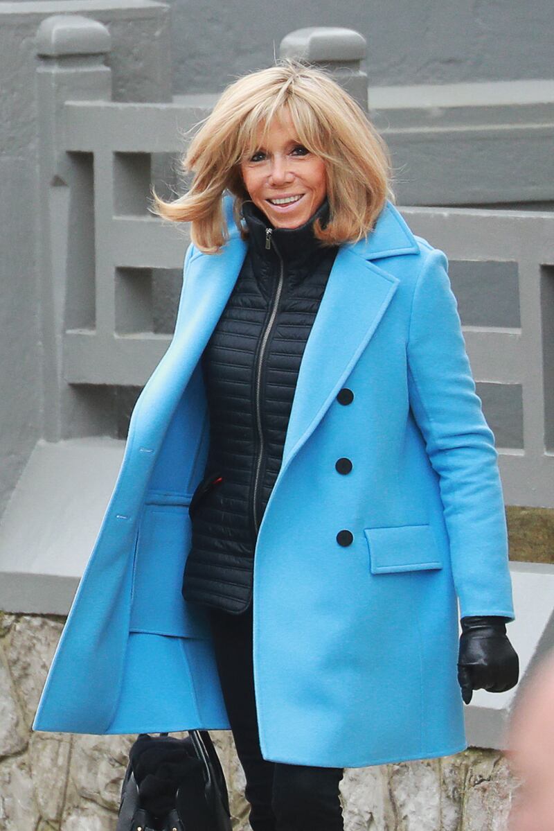 Brigitte, wearing black jeans, a black jacket and blue coat with gloves, during her visit to Le Touquet on March 15, 2020. AFP