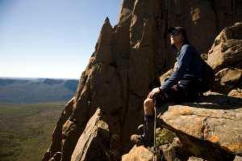 Australia, Tasmania, Central Highlands. A climber takes a break during the ascent of Mount Ossa, the highest mountain in Tasmania at 1614m (Photo by Julian Love / Photolibrary.com) *** Local Caption ***  TR03JA-TASMANIA.jpg