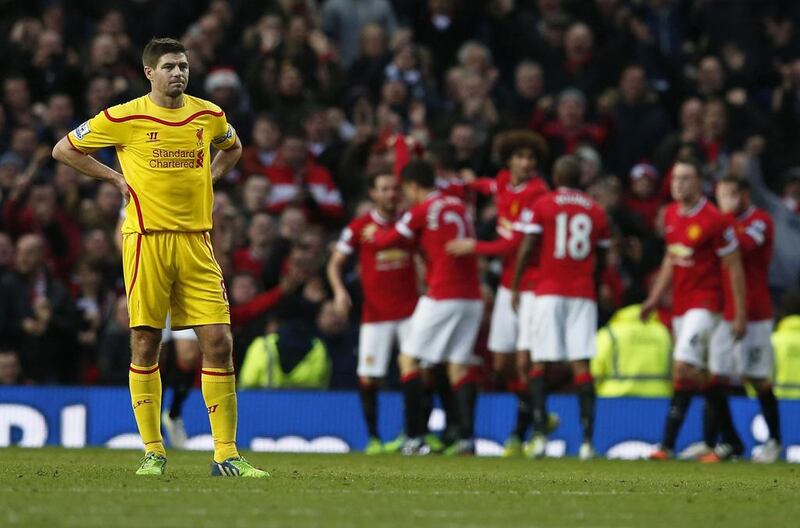 Liverpool's Steven Gerrard reacts after Manchester United's third goal in his side's 3-0 loss in the Premier League on Sunday. Phil Noble / Reuters