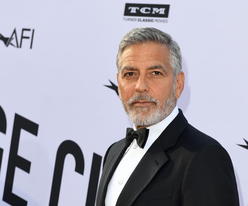 (FILES) In this file photo taken on June 07, 2018 US actor George Clooney attends the 46th American Film Institute Life Achievement Award Gala at the Dolby Theatre in Hollywood. YouTube Premium webcast has commissioned a dark humor comedy that will be co-produced by George Clooney and Kirsten Dunst, who will also be the lead performer, according to the specialized media on June 25, 2018 / AFP / VALERIE MACON
