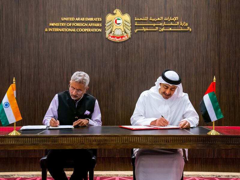 Sheikh Abdullah and Dr Jaishankar sign the minutes of the meeting.