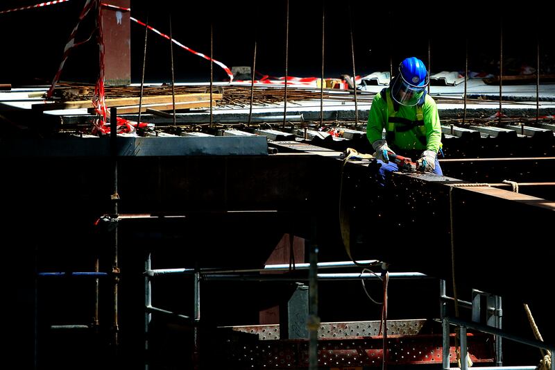 April 12, 2010 / Abu Dhabi / (Rich-Joseph Facun / The National) A man grinds metal while working on the future Abu Dhabi Securities Exchange building under  construction on Sowwah Island, photographed Monday, April 12, 2010.  
(Editors note: Al Maryah Island (formerly Sowwah Island) has been classified as an investment zone, setting it at the forefront of Abu Dhabi's real estate opportunities. It is a 114 hectare mixed-use residential, retail, leisure, hotel and commercial development in the heart of Abu Dhabi. It is designated by the emirate's Urban Planning Council to be the capital's Central Business District (CBD). Sowwah Square is the exclusively commercial first phase of Abu Dhabi's new Central Business District (CBD). (Source: http://www.almaryahisland.ae/)