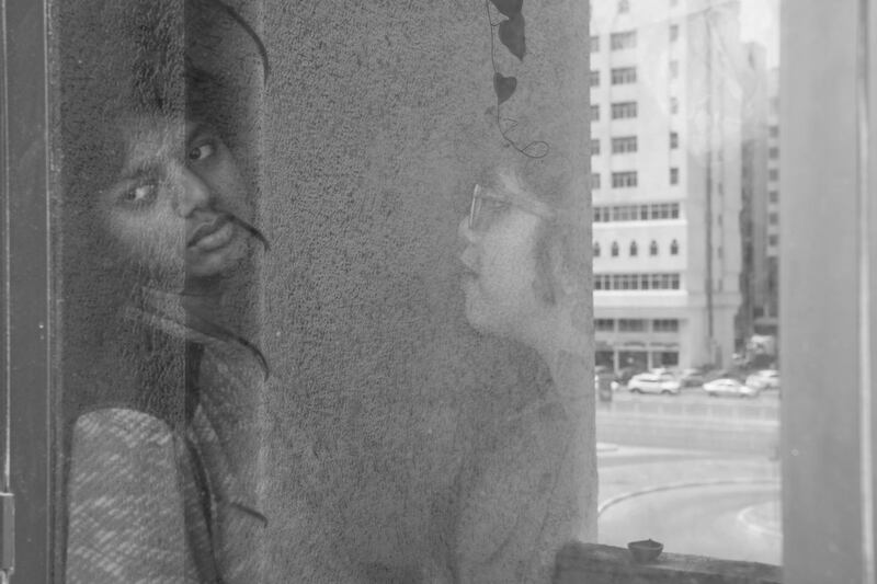 Vidhyaa Chandramohan's children by the window of their Abu Dhabi apartment. Vidhyaa Chandramohan