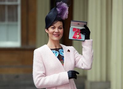 (FILES) In this file photo taken on November 07, 2017 English actress, Helen McCrory poses after she was awarded an Officer of the Most Excellent Order of the British Empire (OBE) for services to drama, by Britain's Queen Elizabeth II during an investiture ceremony at Buckingham Palace in central London.  British film, television and stage actress Helen McCrory has died aged 52 from cancer, her husband and fellow actor Damian Lewis said on April 16, 2021. McCrory "died peacefully at home surrounded by a wave of love from friends and family", Lewis wrote on Twitter, calling his late wife "beautiful and mighty".
 / AFP / POOL / Steve Parsons
