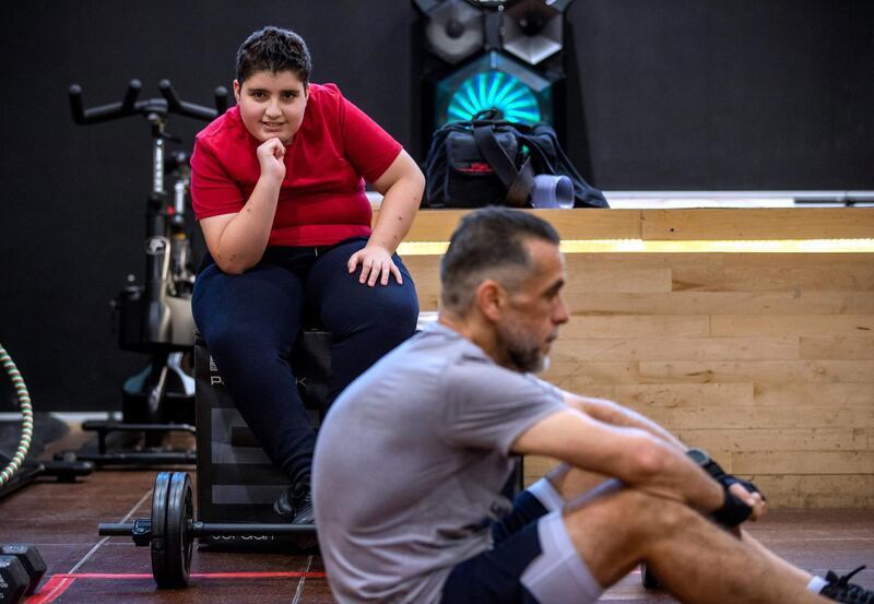 Ihsan Al Sakka does weight training and cardio excercises while his son, Abdulvahab, 14 looks on at the Abu Dhabi Country Club on June 1st, 2021. Victor Besa / The National.
Reporter: Haneen Dajani for News