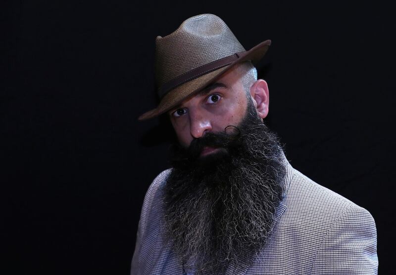 A participant of the international World Beard and Moustache Championships poses before taking part in one of the 17 categories of beard and moustache styles competing in Antwerp, Belgium. Reuters