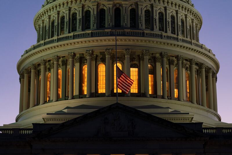 The American flag flies at half-mast at Capitol Hill in Washington. AP