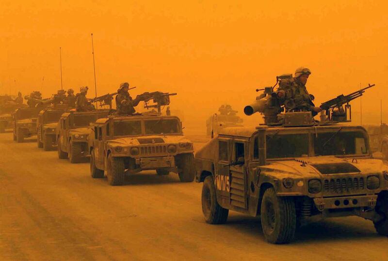 HF47W0 A convoy of US Marine Corps (USMC) High-Mobility Multipurpose Wheeled Vehicles (HMMVW), assigned to D/Company, 1st Light Armored Reconnaissance Battalion, 1st Marines Division, arrives in Northern Iraq, during a sandstorm. USMC personnel are in Iraq in support of Operation IRAQI FREEDOM. Several vehicles are equipped with Tube-launched Optically-tracked Wire-guided (TOW) missile launchers. Iraqi Sandstorm. Alamy