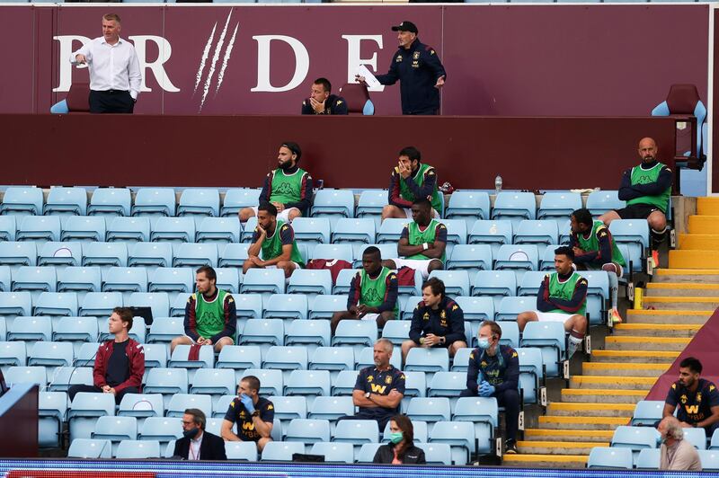 Aston Villa's substitute players maintain social distance. EPA