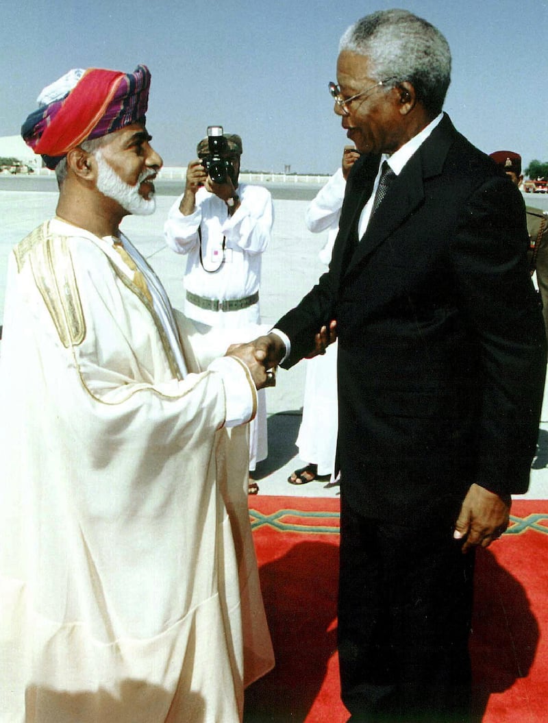 Omani Sultan Qaboos (L) greets South African President Nelson Mandela 06 April 1999 upon his arrival in Muscat at the start of a short tour of the Gulf to promote investments in South Africa. The 80-year-old South African leader is on one of his last official visits abroad before stepping down after the 02 June 1999 elections. (Photo by AFP)