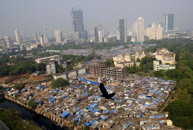 A slum in Mumbai, India. Almost all of the world’s population growth will be in developing countries, with India’s population expected to overtake China’s around 2030. Rafiq Maqbool / AP

