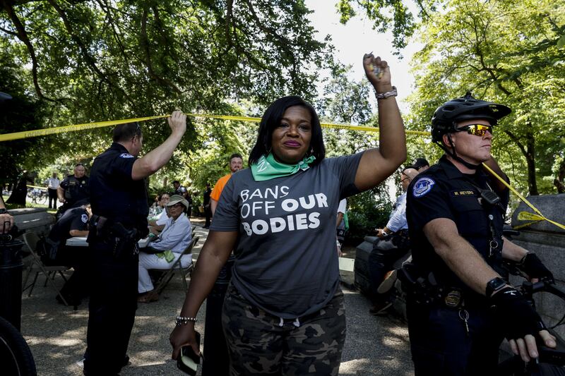 Cori Bush leaves a processing area after being arrested for participating in a sit in. AFP