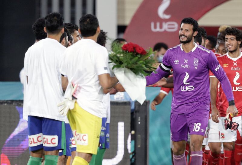 Players of Misr Makkasa (left) and Al-Ahly (right) greet each other prior to the Egyptian Premier League match between Al Ahly and Misr Lel Makkasa in Cairo, Egypt. EPA