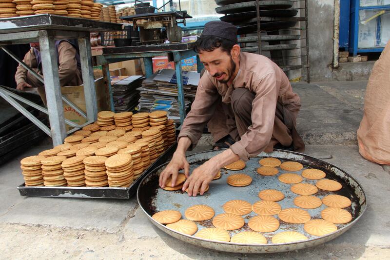 A vendor prepares traditional sweets in Kandahar, southern Afghanistan, before Eid Al Adha. EPA
