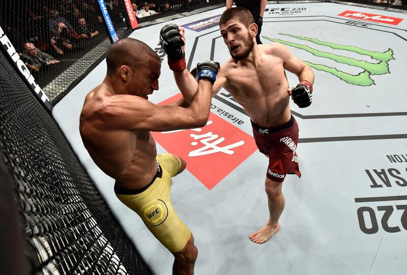LAS VEGAS, NV - DECEMBER 30:  (R-L) Khabib Nurmagomedov of Russia punches Edson Barboza of Brazil in their lightweight bout during the UFC 219 event inside T-Mobile Arena on December 30, 2017 in Las Vegas, Nevada. (Photo by Jeff Bottari/Zuffa LLC/Zuffa LLC via Getty Images)