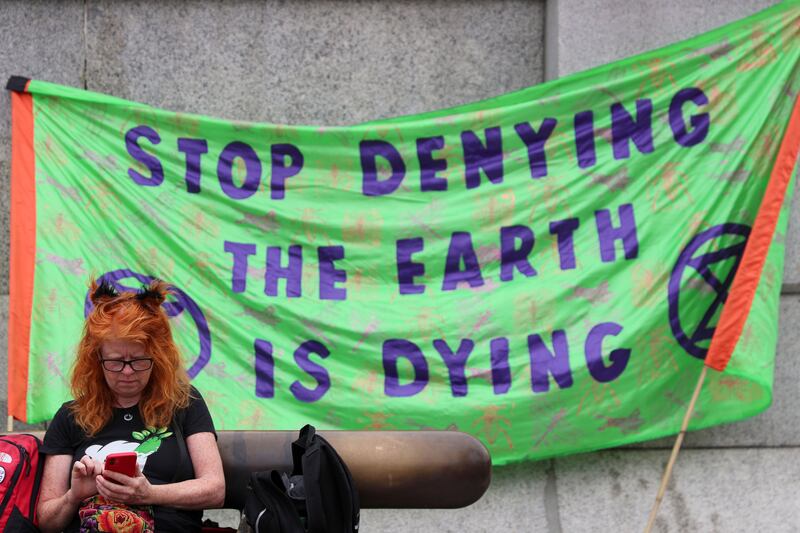 A climate activist takes part in a 'March for Nature' protest demanding an immediate stop to all new fossil fuel investments, at London's Trafalgar Square on Saturday. Reuters