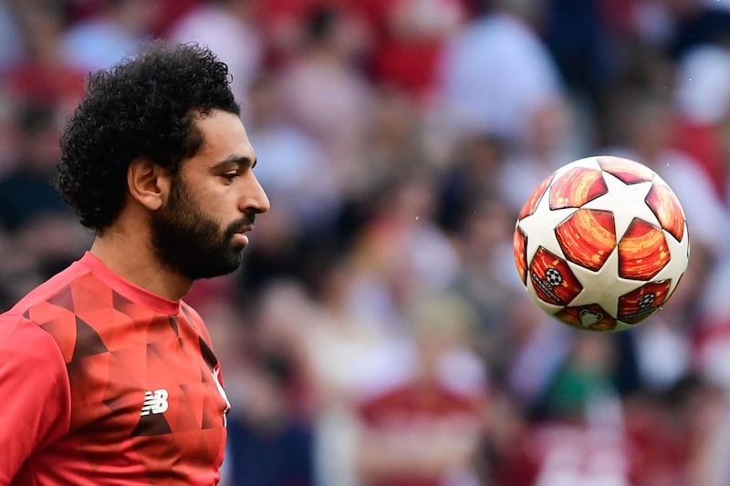 (FILES) A file photo taken on June 01, 2019 shows Liverpool's Egyptian midfielder Mohamed Salah warming up before the start of the UEFA Champions League final football match between Liverpool and Tottenham Hotspur at the Wanda Metropolitan Stadium in Madrid. / AFP / JAVIER SORIANO
