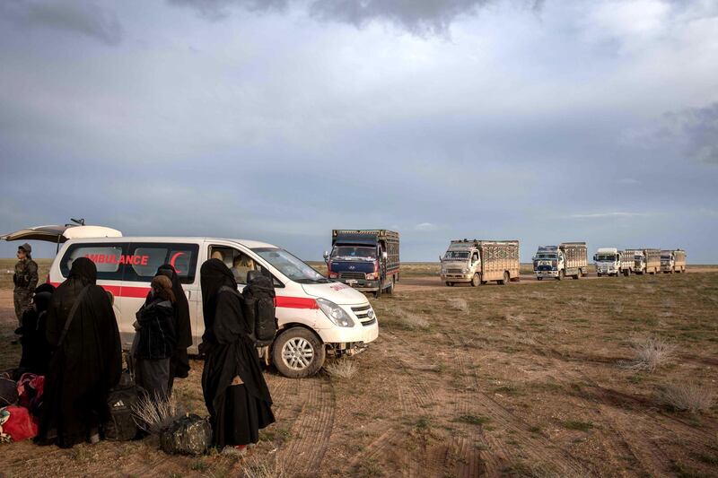 Trucks evacuating people from the last pocket of ISIS territory in Syria arrive outside Baghouz, 28 February 2019. Campbell MacDiarmid