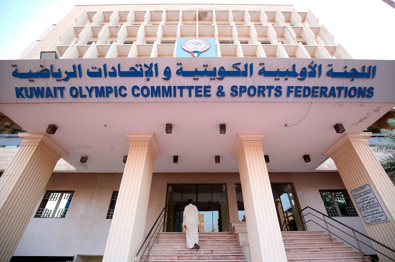 A Kuwaiti man enters the Kuwait Olympic Committee and Sports Federation building in Kuwait City. The International Olympic Committee lifted a ban on Kuwait, allowing the Gulf state to take part in the Asian Games in Jakarta. AFP