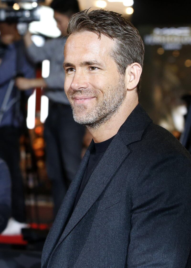 epa06704254 Canadian actor/cast member Ryan Reynolds poses for photographs as he arrives for the premiere of 'Deadpool 2' the Lotte World Tower Special Outdoor Stage in Seoul, South Korea, 01 May 2018. The movie will open in South Korean theaters on 16 May.  EPA/KIM HEE-CHUL