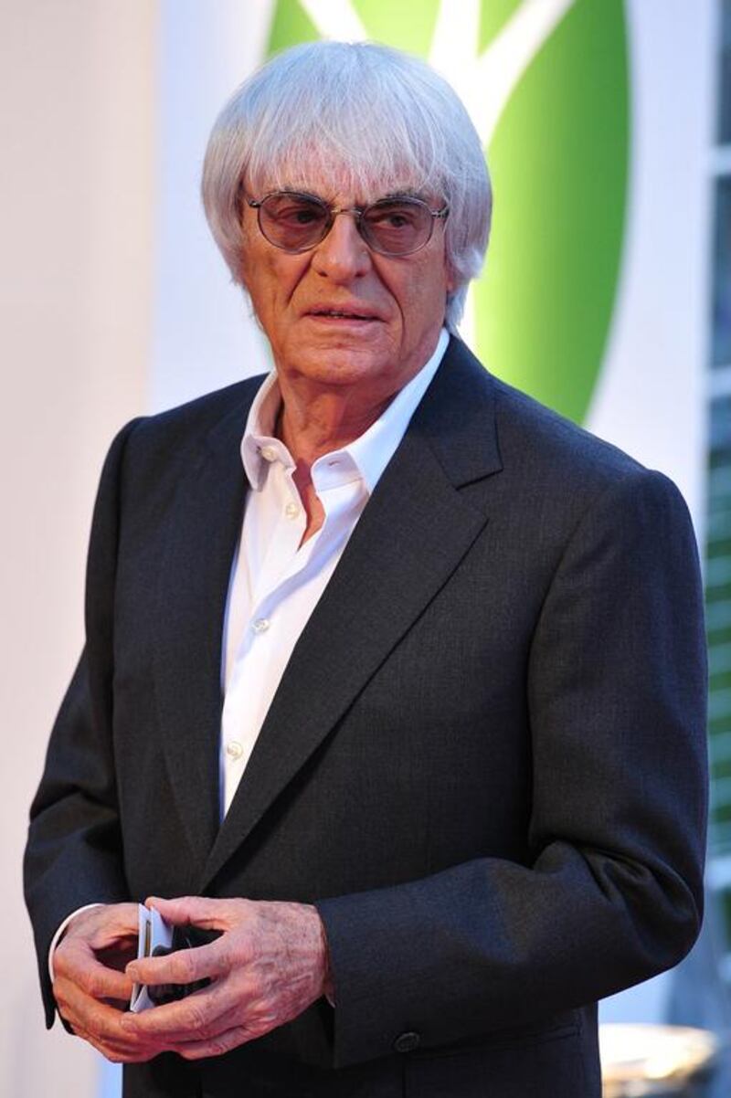 Bernie Ecclestone says he will continue to run Formula One's day to day affairs despite stepping down from as the director of the holding company that controls the series until the conclusion of his trial on bribery charges in a Munich court. AFP PHOTO/CARL COURT