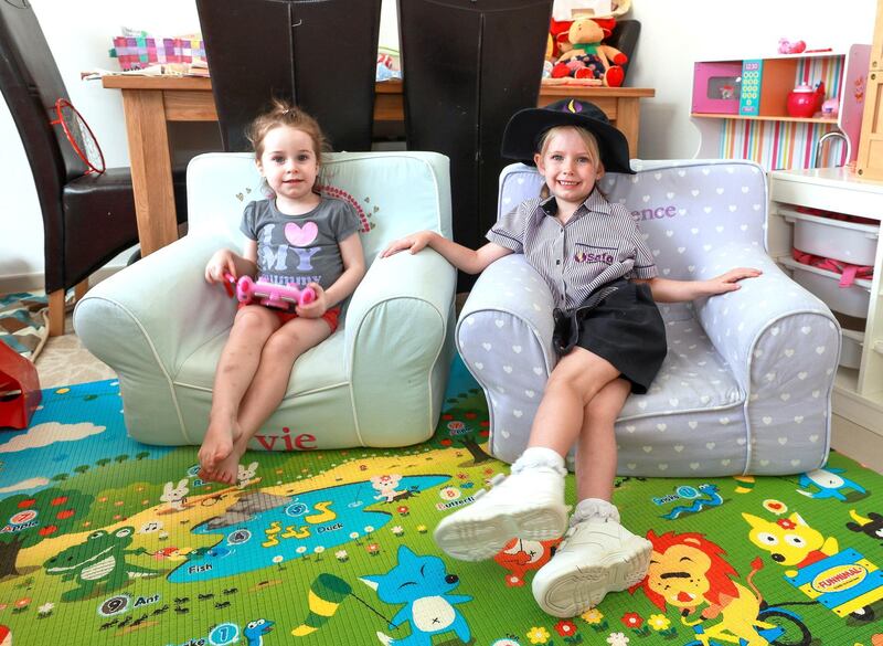 Dubai, U.A.E., August 27 , 2018. 
Parents facing high costs to buy school uniforms.  Florence Hughes- 4 in her Safa Community School uniform with her sister, Yvie-2.
Victor Besa/The National
Section:  NA
Reporter:  Patrick Ryan