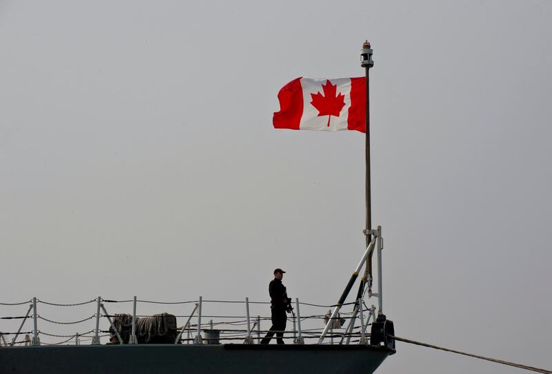 (FILES) This file photograph taken on March 13, 2015, shows a Canadian soldier as he stands on board frigate HMCS Fredericton docked at Constanta Harbour in Constanta, Romania. Debris from a Canadian military helicopter operating as part of a NATO surveillance force has been found in the sea between Greece and Italy, a Greek military source said April 30, 2020. The helicopter was attached to the Canadian frigate Fredericton, from which it had taken off for a patrol.
 / AFP / Daniel MIHAILESCU
