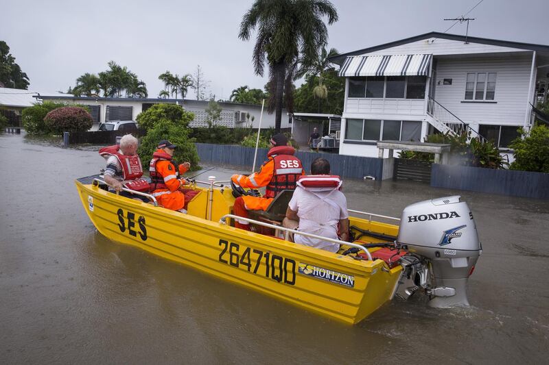 SES volunteers rescued residents in Rosslea, Townsville, as tThousands of residents were evacuated. EPA