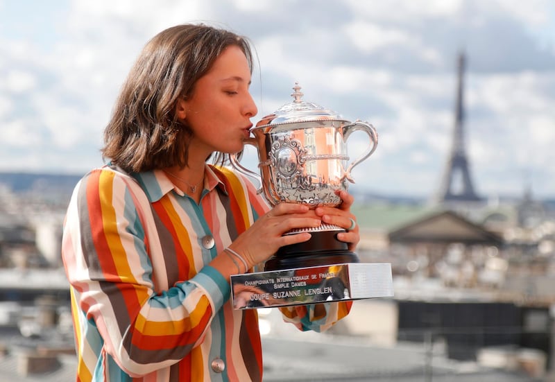 Poland's Iga Swiatek poses with the trophy after winning the French Open tournament at the Galeries Lafayette Rooftop, Paris. Reuters