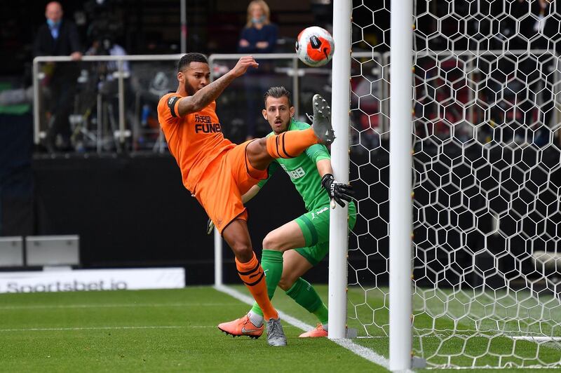 Jamaal Lascelles - 7: Vital clearance off the line in first half after Welbeck's shot had hit the post. Great block to deny Deeney after break. Booked for cynical foul to stop Doucoure when the French midfielder was bearing down on Newcastle goal and went off injured before the end. Getty