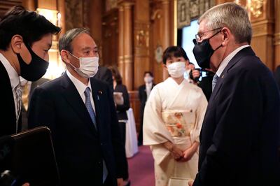 Japanese Prime Minister Yoshihide Suga and IOC President Thomas Bach have been determined to continue with the Olympics despite the Covid-19 pandemic. AP Photo