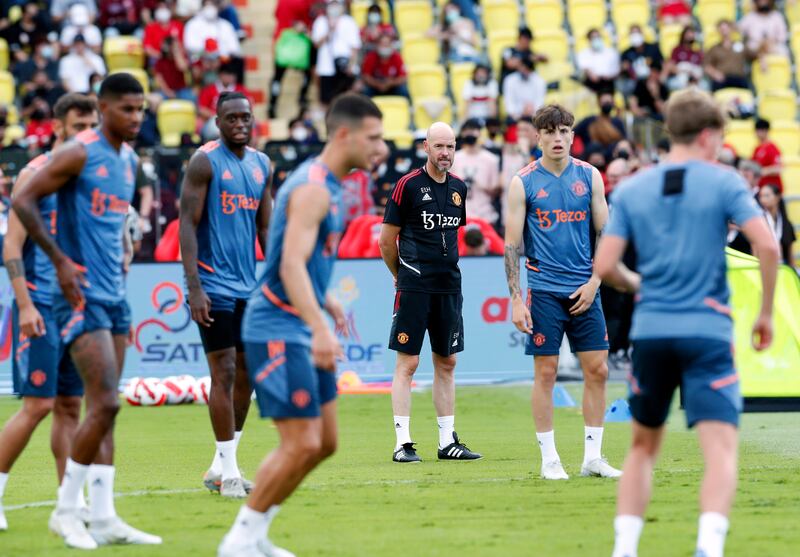 Manchester United manager Erik ten Hag, centre, leads his team's training session at Rajamangala National Stadium in Bangkok, on Monday, July 12, 2022. United take on Liverpool in a pre-season friendly on Tuesday. EPA