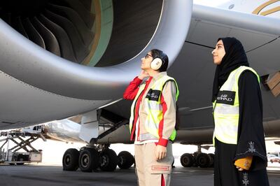 Etihad Airways Technical Engineer Soukaina Sabyh inspects the engine before departure with Safety Manager Reem Almutawwa. Courtesy Etihad Airways