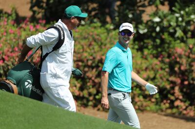 Justin Rose of England smiles as he walks up the 10th fairway during the second day of practice for the 2018 Masters golf tournament at Augusta National Golf Club in Augusta, Georgia, U.S. April 3, 2018. REUTERS/Lucy Nicholson