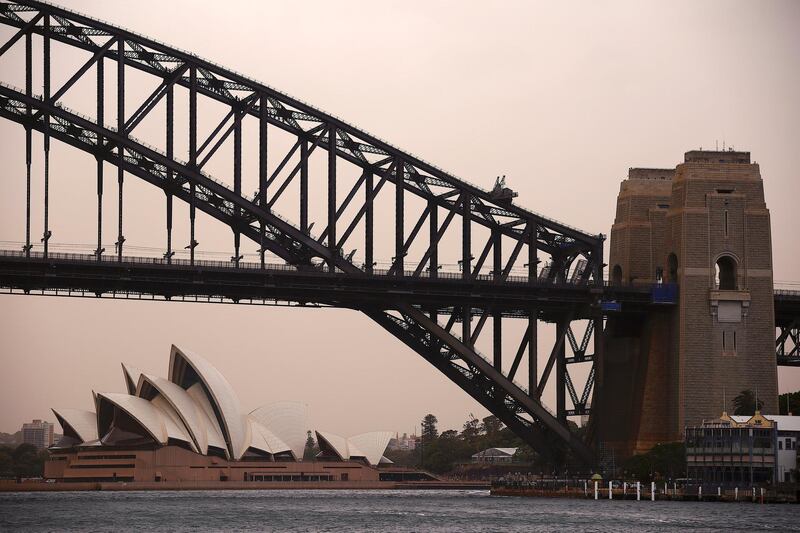 The Sydney Harbour Bridge and Sydney Opera House can be seen during a dust storm. Reuters