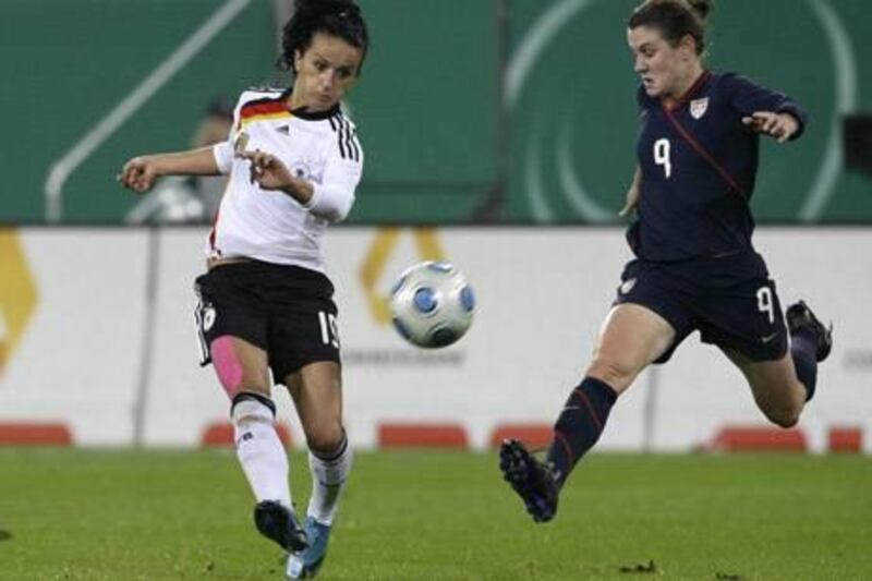 Germany's Fatmire Bajramaj (L) fights for the ball with Heather O'Reilly of the U.S. during their women's friendly international soccer match in Augsburg October 29, 2009. REUTERS/Michaela Rehle (GERMANY SPORT SOCCER)
Picture Supplied by Action Images *** Local Caption *** 2009-10-29T182252Z_01_REH24_RTRIDSP_3_SOCCER.jpg *** Local Caption *** 2009-10-29T182252Z_01_REH24_RTRIDSP_3_SOCCER.jpg