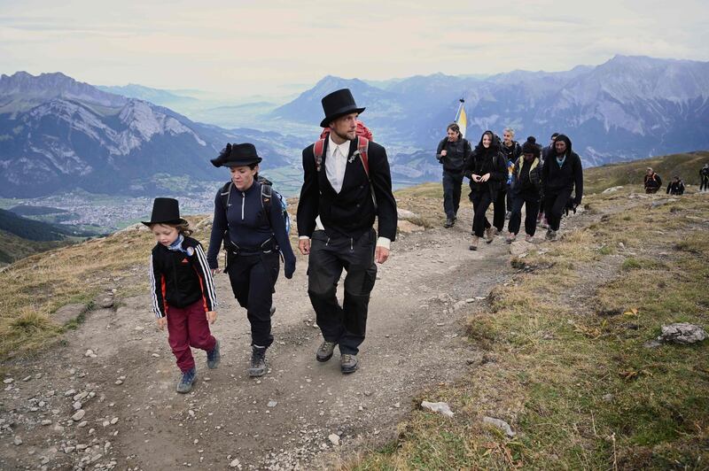 People take part in a ceremony to mark the 'death' of the Pizol glacier (Pizolgletscher) above Mels, eastern Switzerland.  AFP