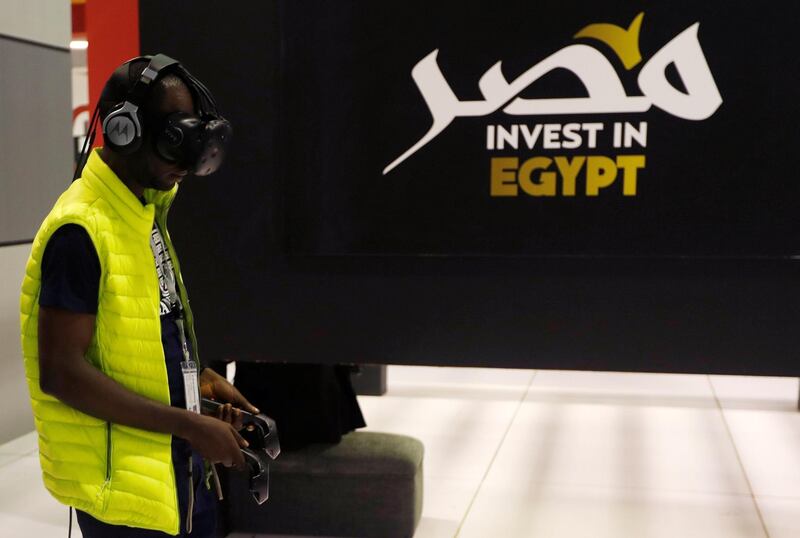 An African visitor uses virtual reality (VR) glasses at Africa 2018 Forum in the Red Sea resort of Sharm el-Sheikh, Egypt December 8, 2018. REUTERS/Amr Abdallah Dalsh