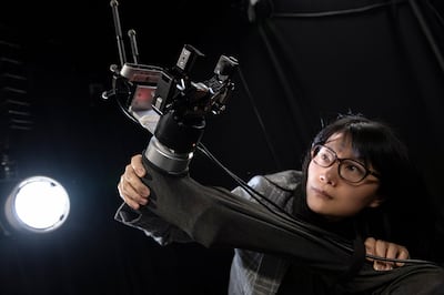 Prof Yang Gao is developing a robotic arm system to use in the race to solve the problem of space junk. Photo: Max Alexander