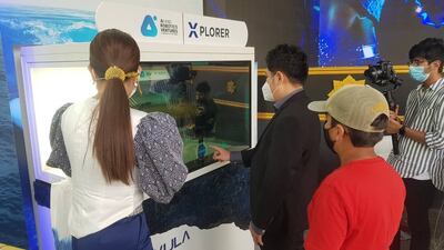 Visitors take a look at the Xplorer stand