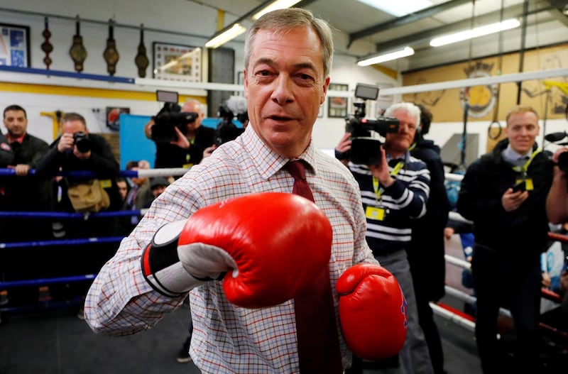Brexit Party leader Nigel Farage wears boxing gloves at a general election campaign event at Bolsover Boxing Club in Chesterfield, Britain November 5, 2019. REUTERS/Phil Noble     TPX IMAGES OF THE DAY