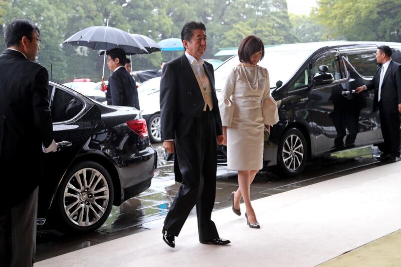 Japan's Prime Minister Shinzo Abe, left, and his wife Akie arrive at the Imperial Palace to attend the proclamation ceremony of Japan's Emperor Naruhito on October 22, 2019 in Tokyo, Japan. Getty Images